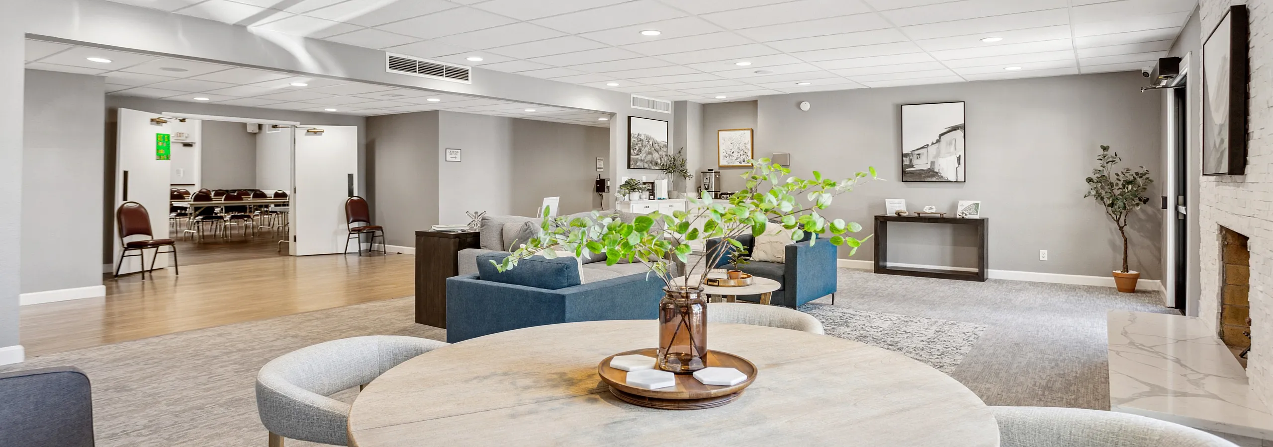 Inviting communal space with stylish furnishings, warm lighting, and a cozy lounge area, perfect for gatherings.