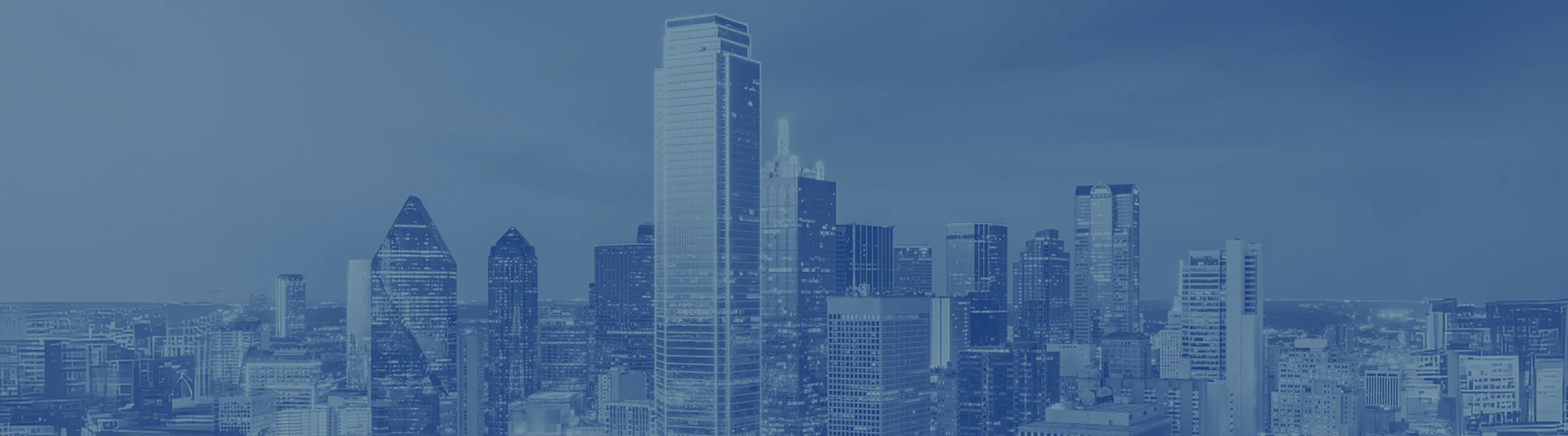 Breathtaking urban skyline with modern high-rise buildings under a tranquil blue sky.