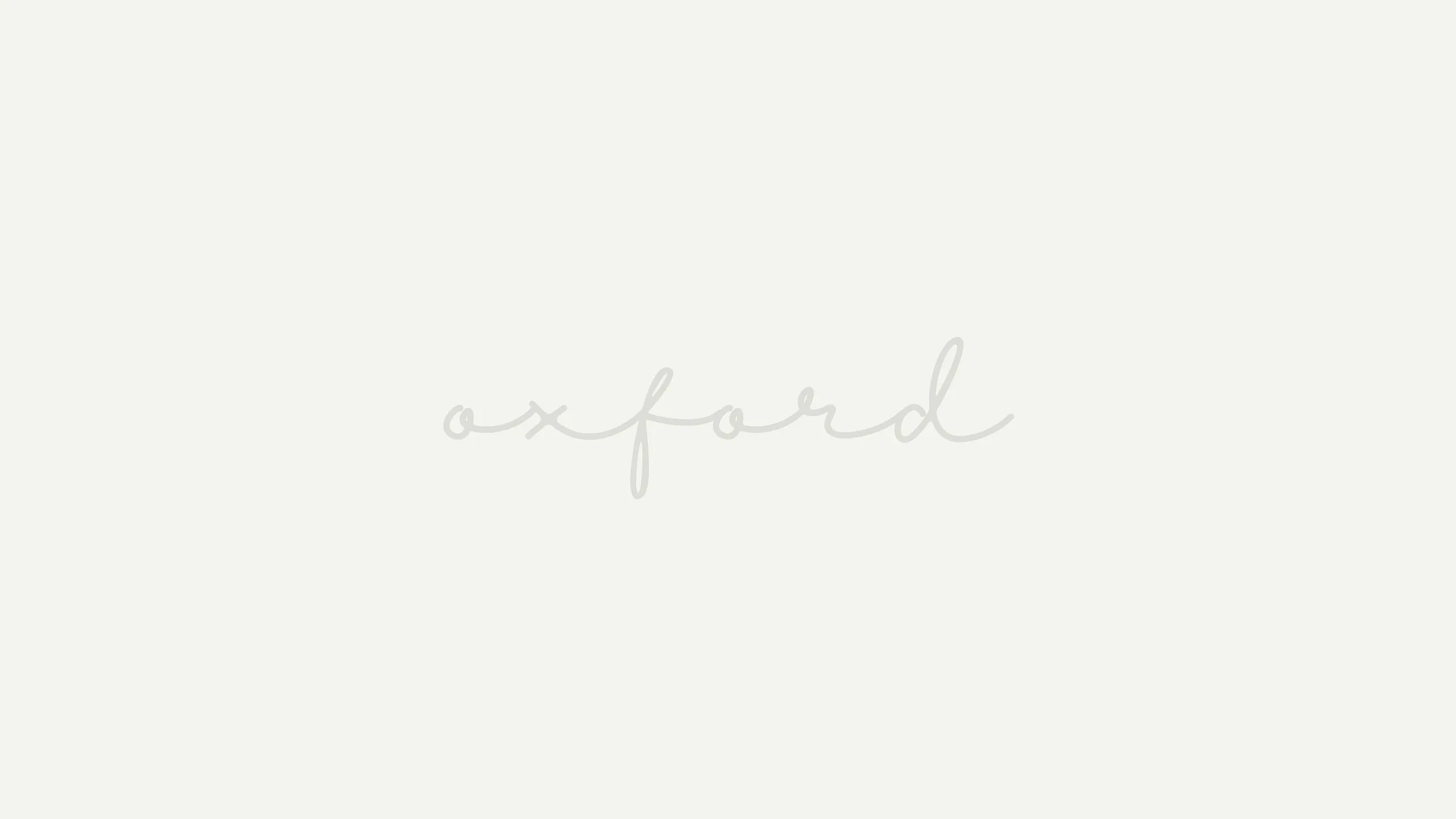Elegant and minimalist 'Oxford' text design in soft gray on a light background, perfect for a sophisticated branding concept.