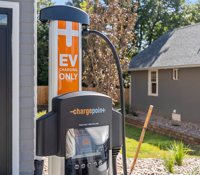 Modern EV charging station in a residential setting, highlighting convenience and eco-friendly amenities.