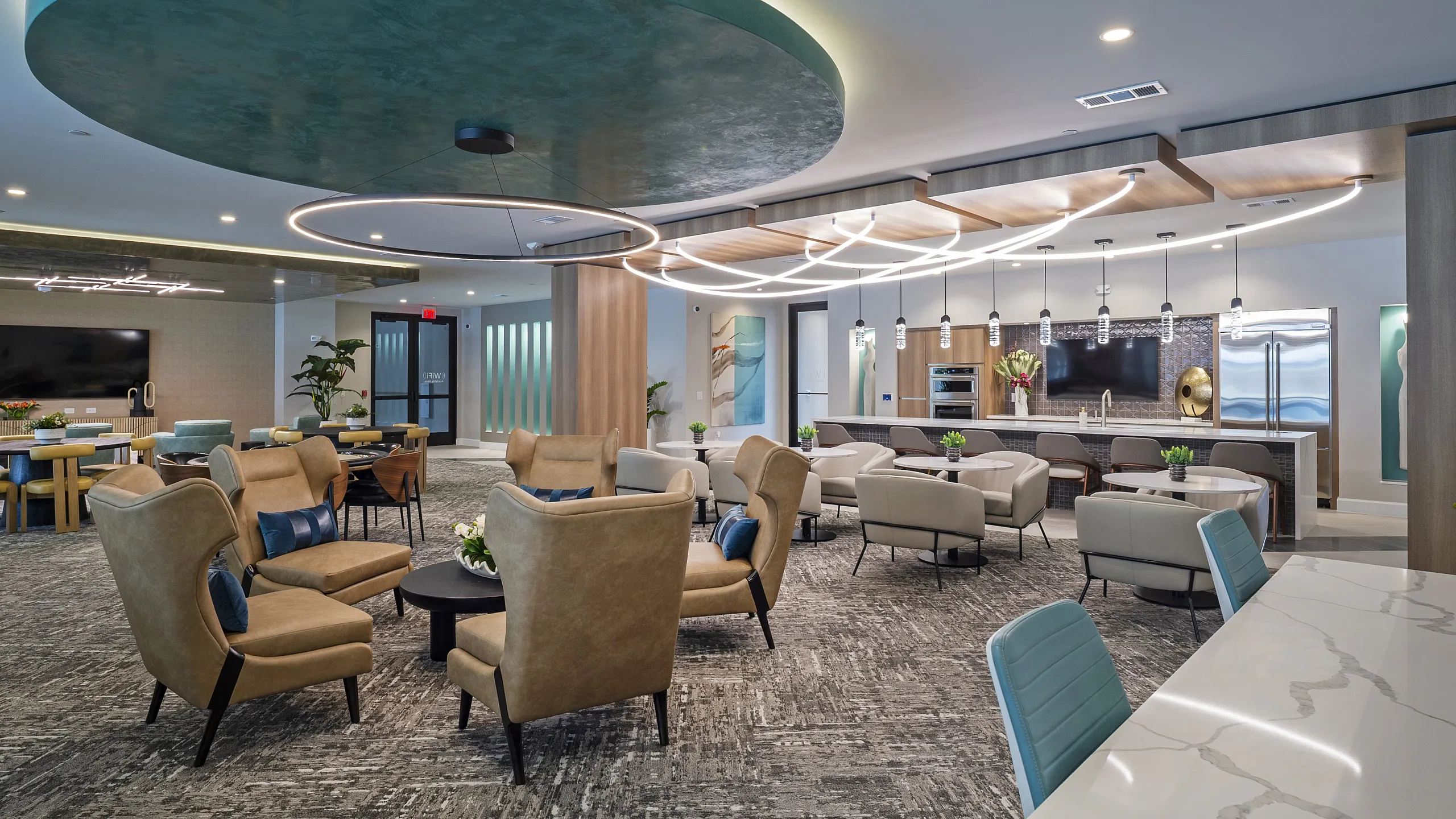 Luxurious contemporary lounge area with elegant seating, modern lighting fixtures, and an inviting open kitchen design.