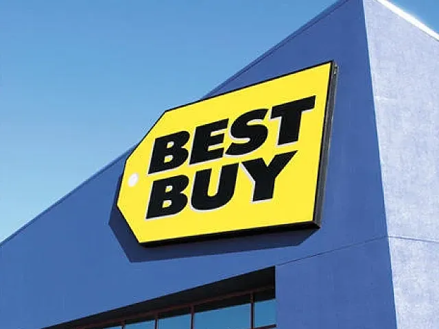 Vibrant blue retail store exterior with a prominent yellow sign displaying bold lettering.