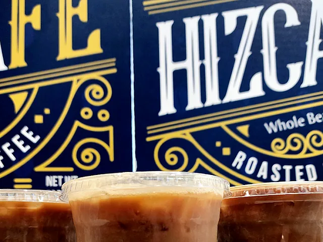Enticing trio of iced lattes with creamy layers against a vibrant coffee shop backdrop.