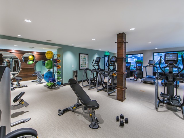 Club-style fitness center with private TV\'s on cardio equipment and complete strength training stations