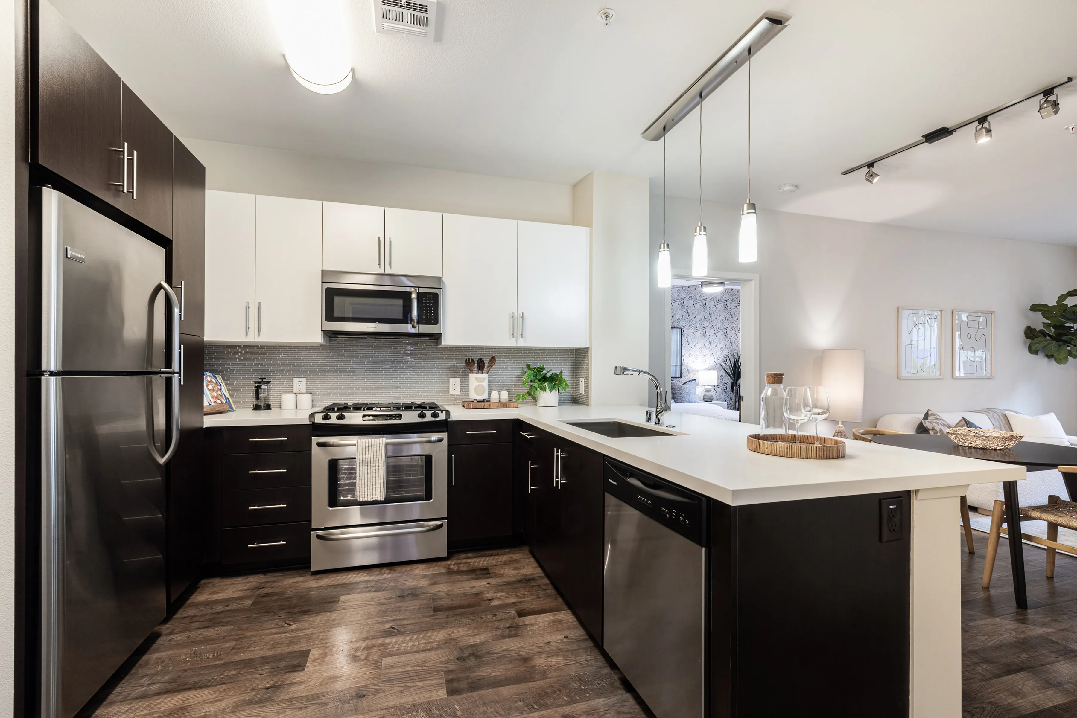 Gourmet kitchens with stainless steel appliances, gas cooking and oversized deep sinks