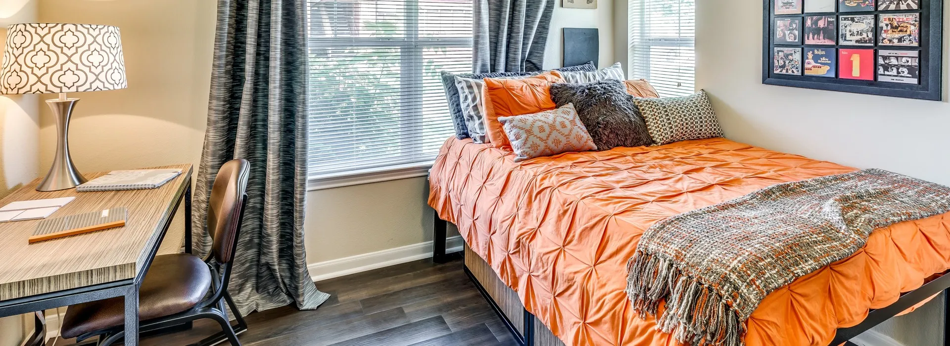Interior - Furnished bedroom with desk  - Campus Lodge Apartments in Columbia, MO