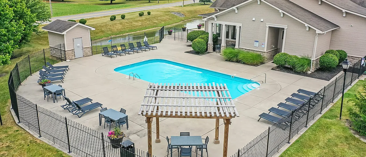 Outdoor pool area with lounge chairs