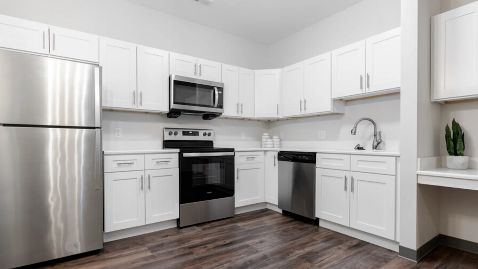 Retreat Kitchen with White Cabinets and Stainless Appliances