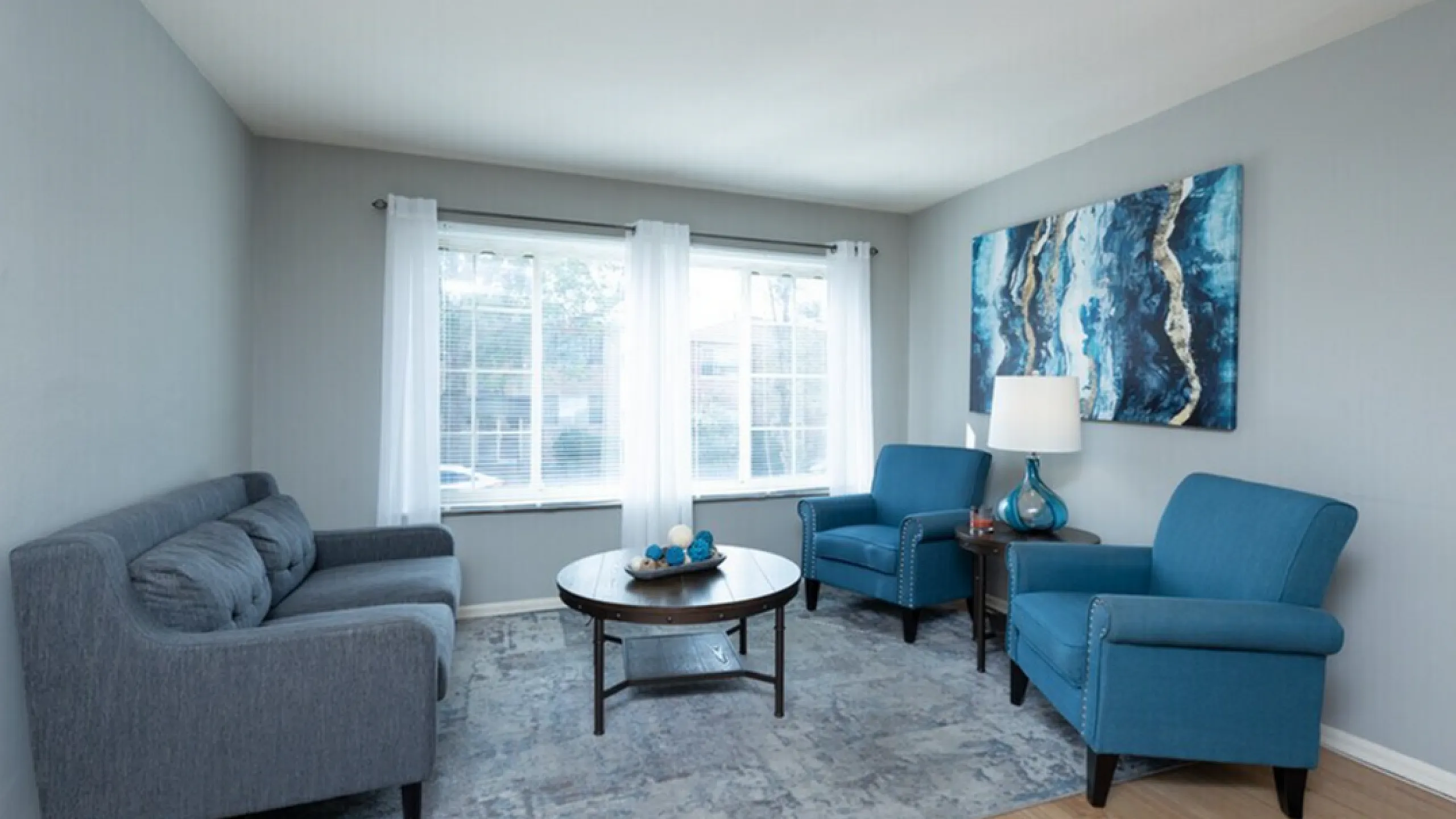 Living room with couch and chairs