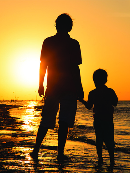 man and son on the beach