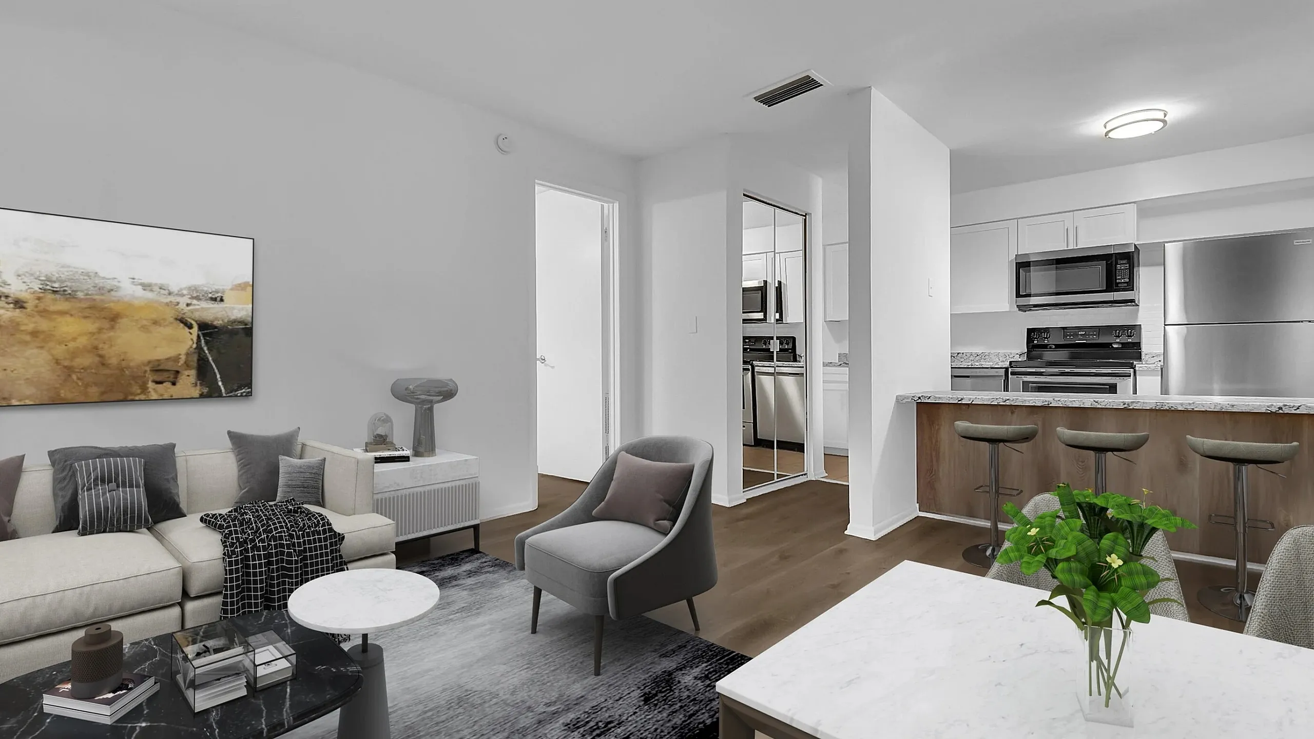 Bright and airy living room with modern decor, open kitchen, and sleek appliances creating a welcoming ambiance.
