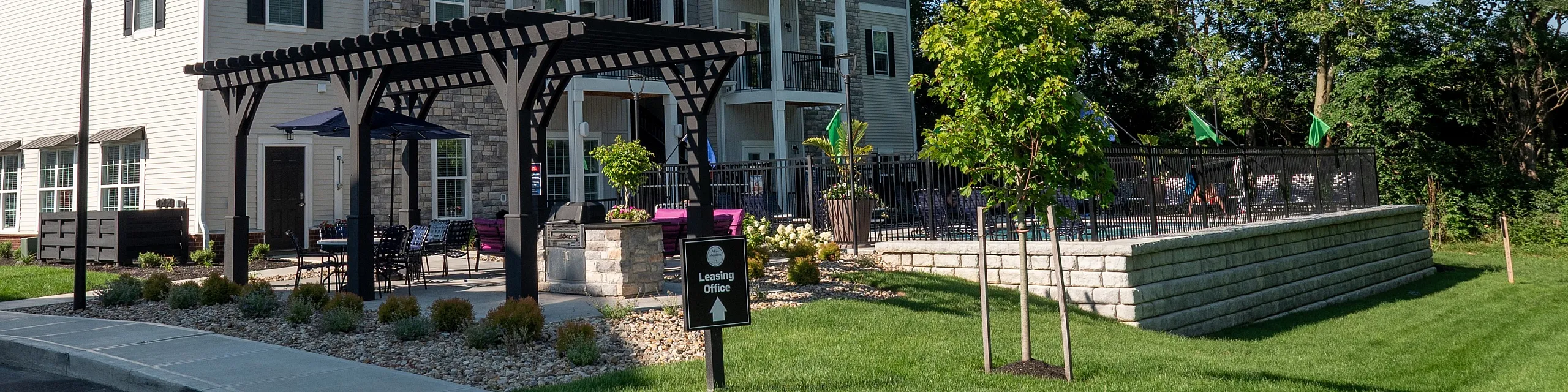 Charming apartment complex with modern architecture, inviting balcony spaces, and beautifully landscaped surroundings.