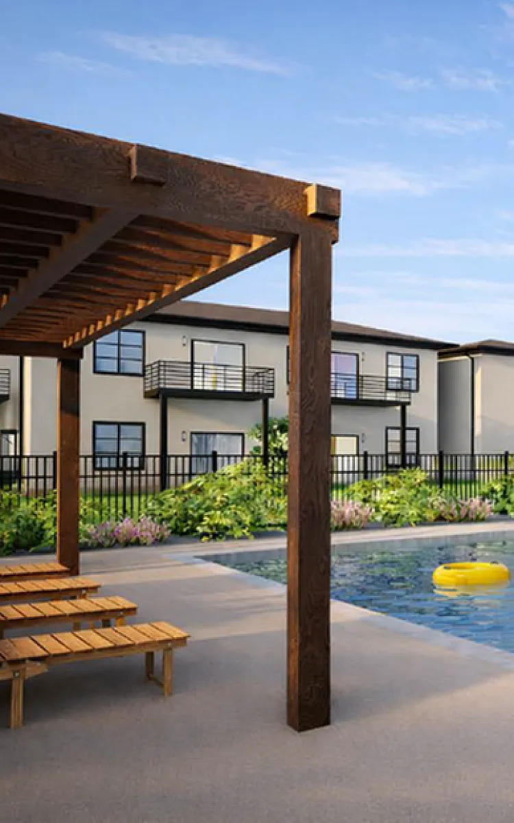 Inviting apartment community with a serene outdoor pool area, lush landscaping, and stylish pergola seating.