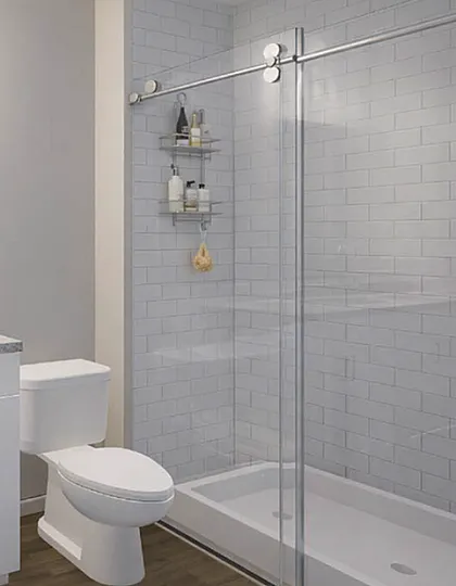 Elegant bathroom showcasing a dual sink vanity, large mirror, and sleek glass-enclosed shower with modern fixtures.