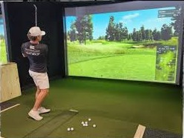 Man using Golf simulator