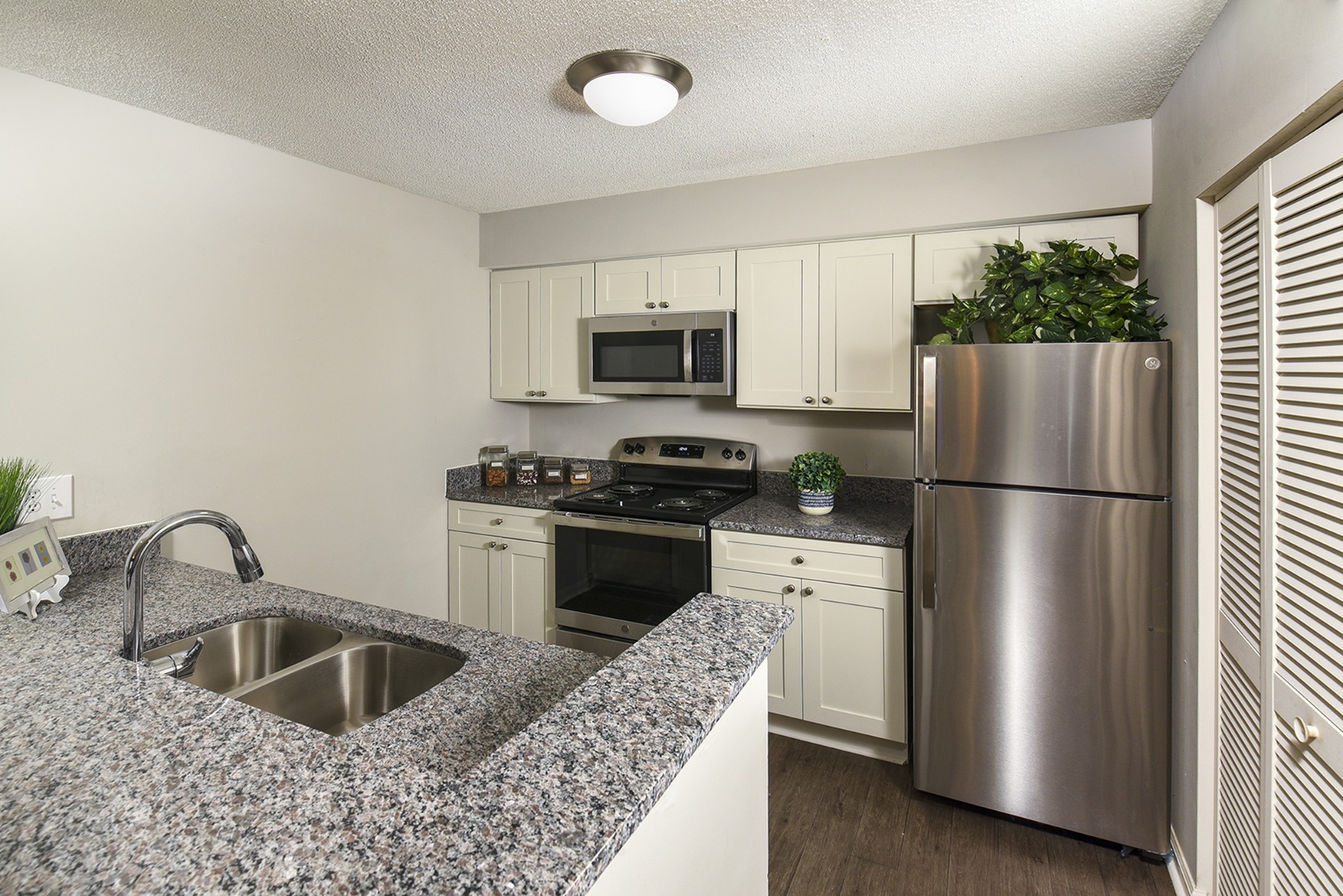 White Cabinets | Stainless Steel Appliances | Granite Countertops