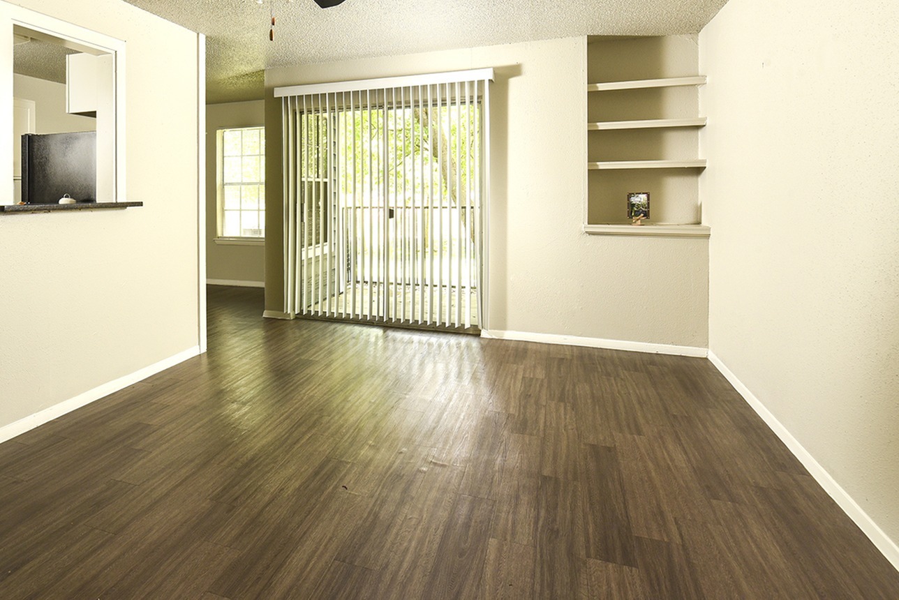 Bookshelves, sliding glass door, plank flooring