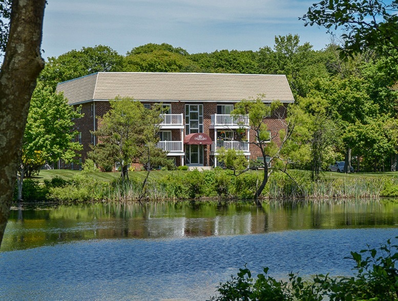 Exterior of brick building over looking the fishing pond.
