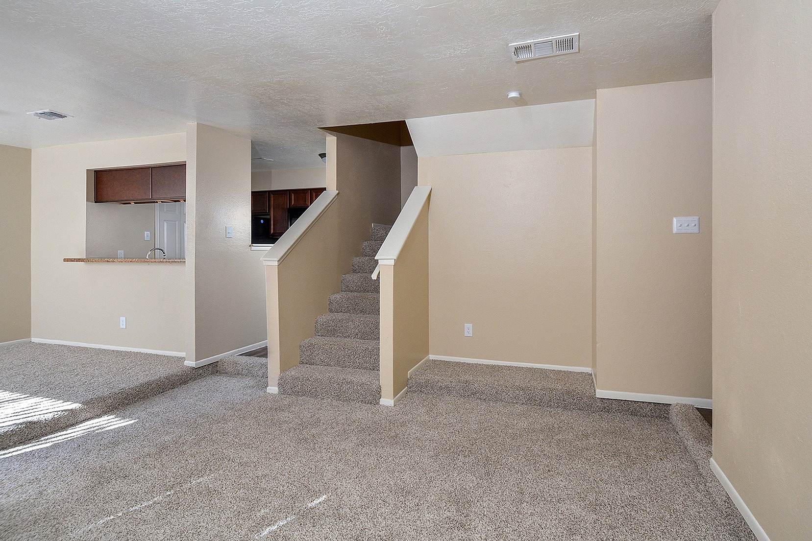 Townhome | Stairs | Kitchen | carpet