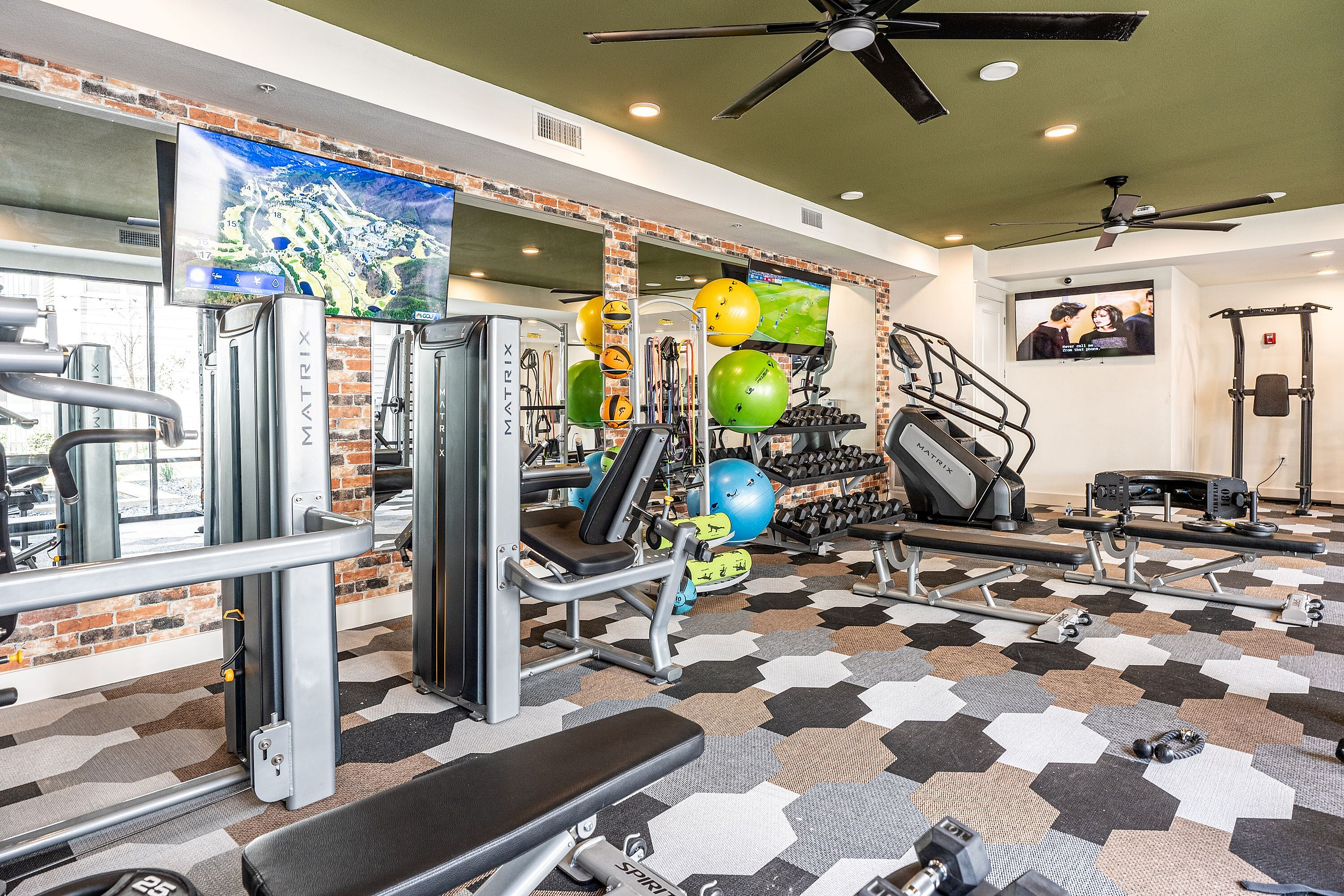 Vibrant, modern gym with state-of-the-art equipment, lively decor, and ample space for workouts.