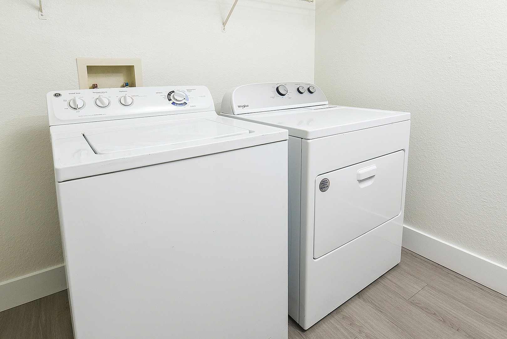 Modern laundry room with sleek washer and dryer, perfect for efficient and convenient use.