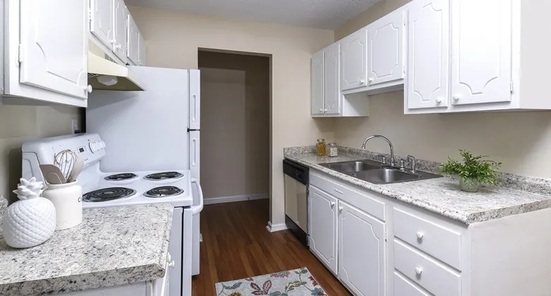 Galley Kitchen with White cabinets