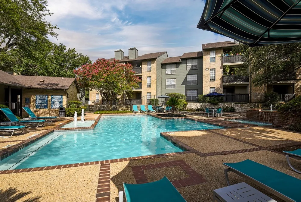 Oak Springs pool | Exterior of buildings in the background