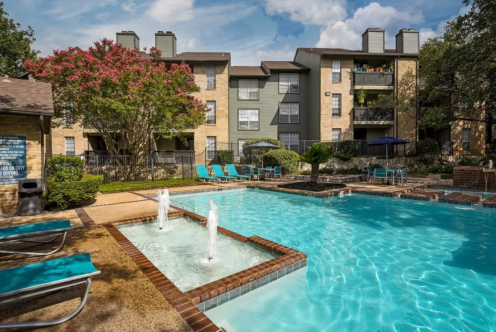 Pool Area | Small Fountains in Pool | Exterior of Building