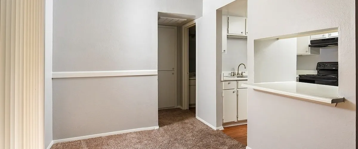 Open Kitchen into dining area | White cabinets | black appliances