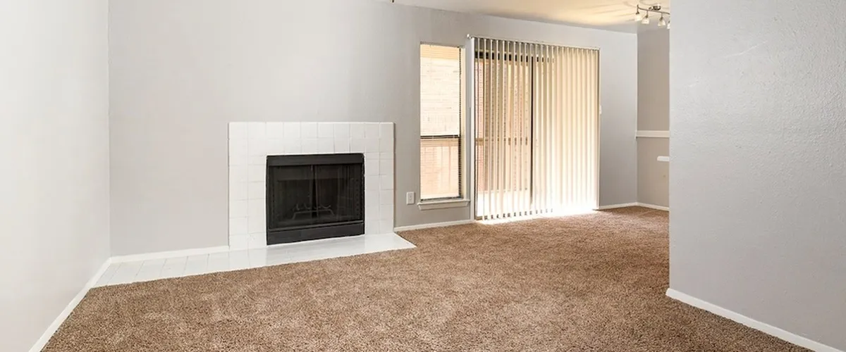 Fireplace | white tile | carpet | sliding glass door