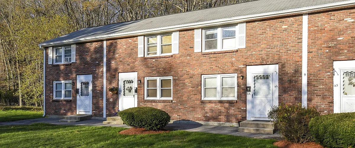 Exterior og building with brick and white trim