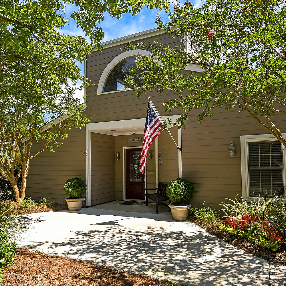 Front door of leasing office | American Flag