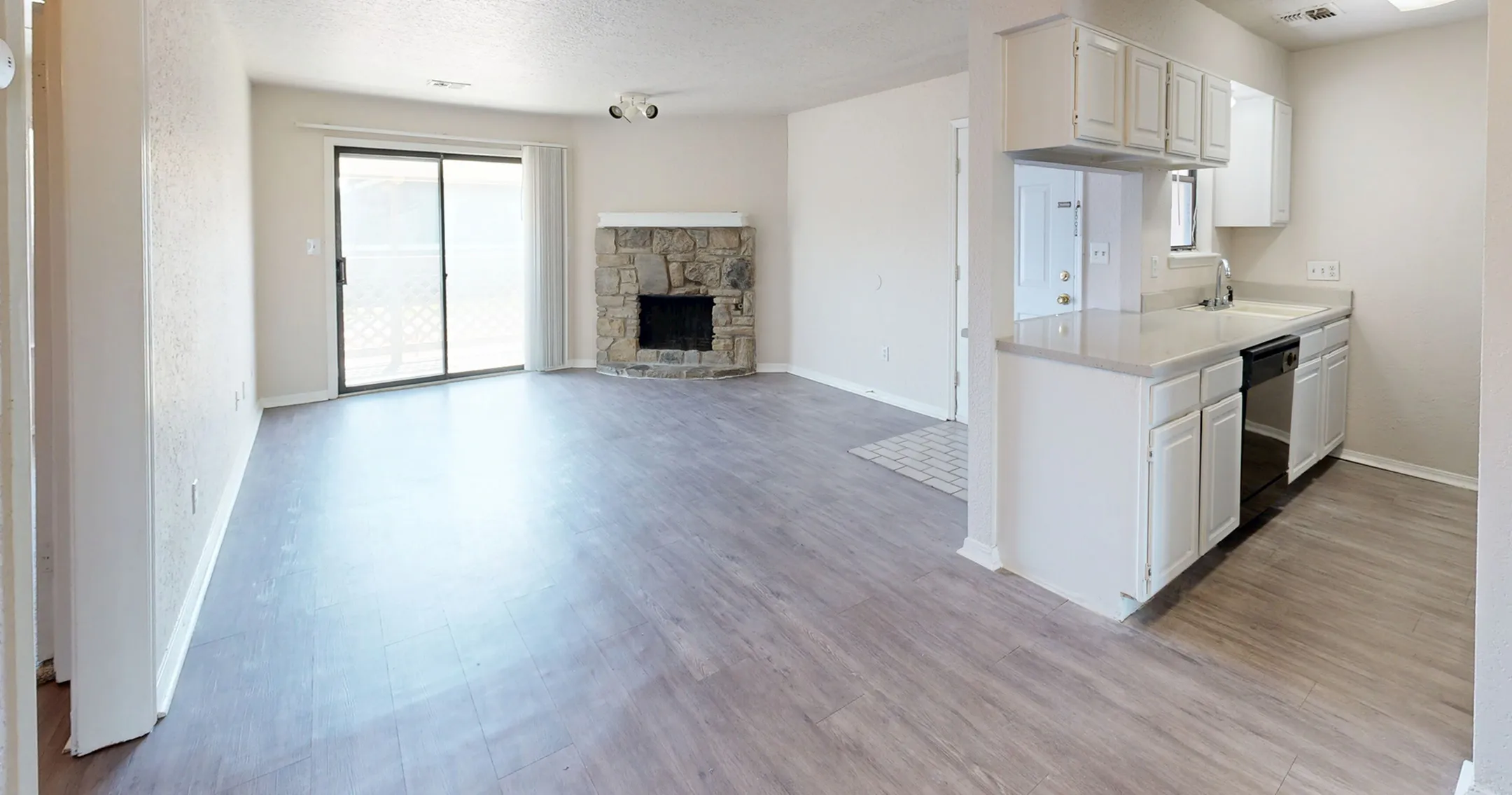 Contemporary design meets functionality in this open kitchen with striking black appliances.