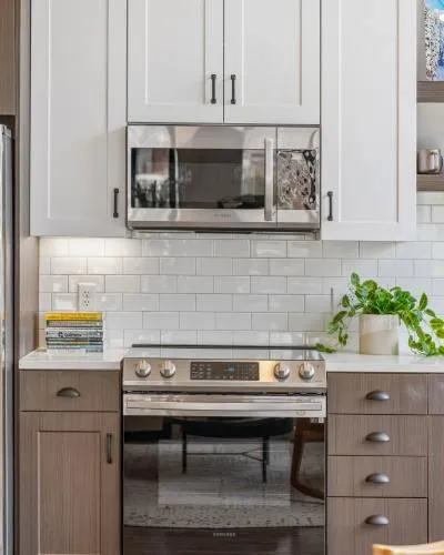 Modern kitchen with stainless steel appliances and bright cabinetry