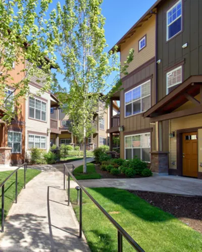 Beautiful garden apartments with lush greenery and modern design.