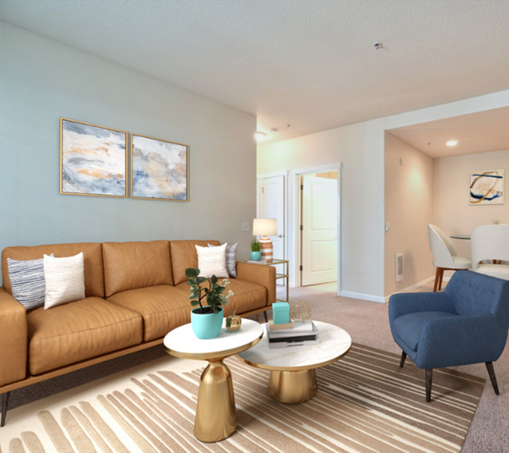 Stylish living room with leather sofa, elegant coffee tables, and cozy seating arrangement.