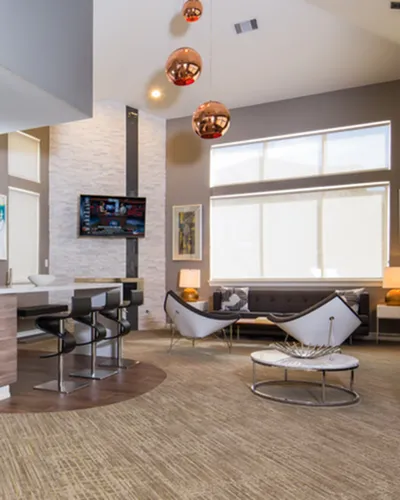 Modern and elegant apartment interior with an open-concept living area, stylish seating, and contemporary decor highlighted by large windows and sleek lighting.