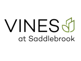 Elegant logo for Vines at Saddlebrook with a modern leaf design, conveying a sleek and contemporary brand identity.