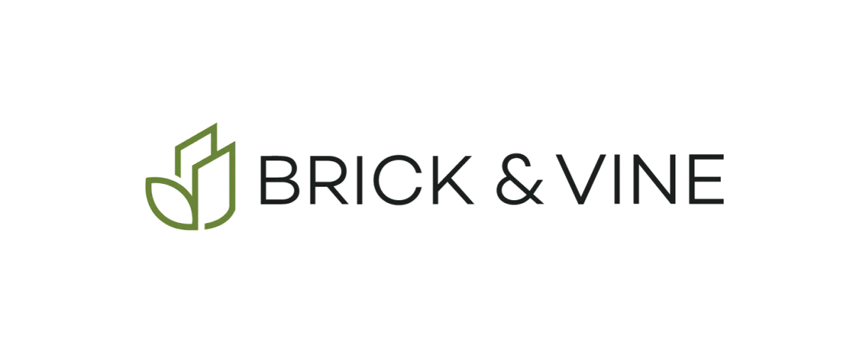 Brick & Vine logo featuring modern green leaf design intertwined with geometric elegance.