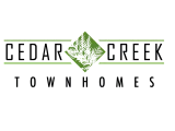 Elegant green logo featuring a stylized, nature-inspired design with symmetrical lines and intricate foliage.