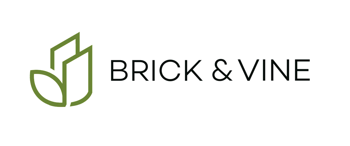 Sleek Brick & Vine logo with green geometric leaves symbolizing modern design and nature.
