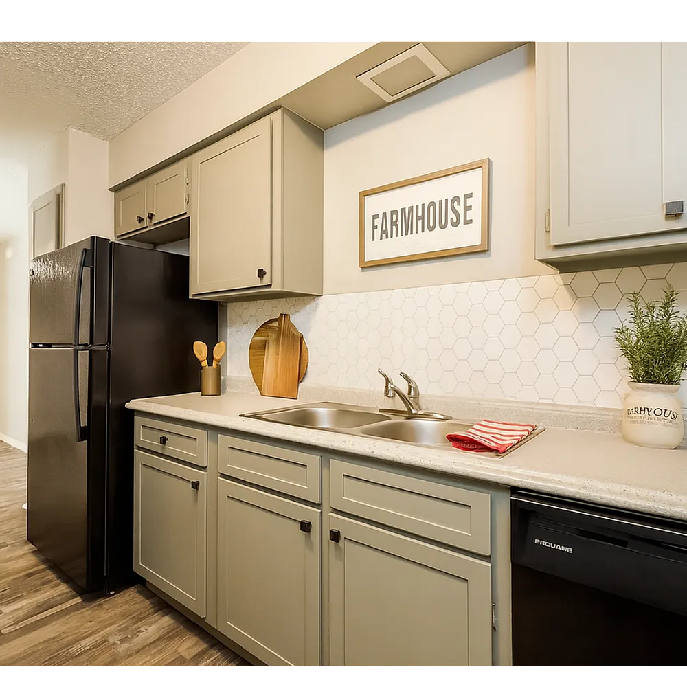 Charming kitchen with farmhouse decor, featuring modern appliances, sleek cabinetry, and warm wooden flooring.