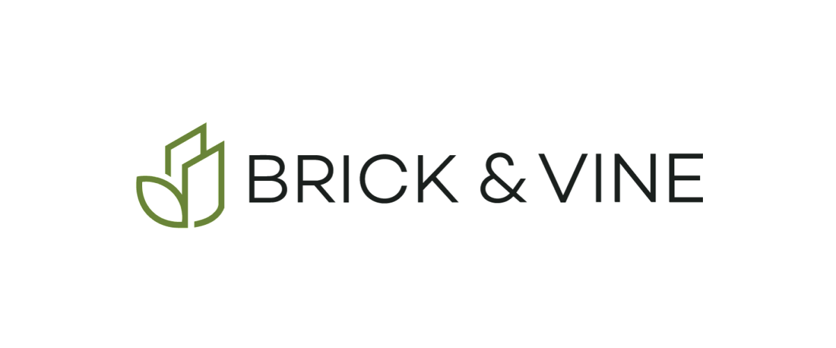 Elegant Brick & Vine logo featuring modern design with a green leaf icon.