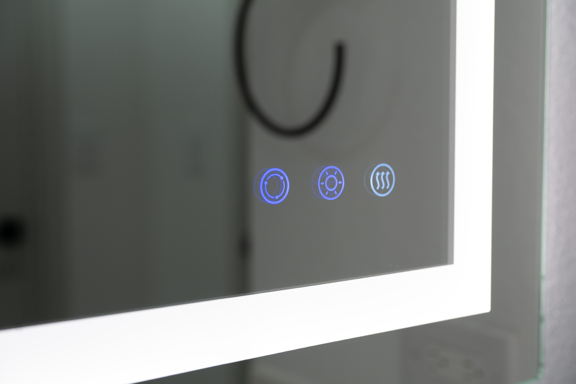 Modern bathroom mirror with illuminated touch controls and sleek design.