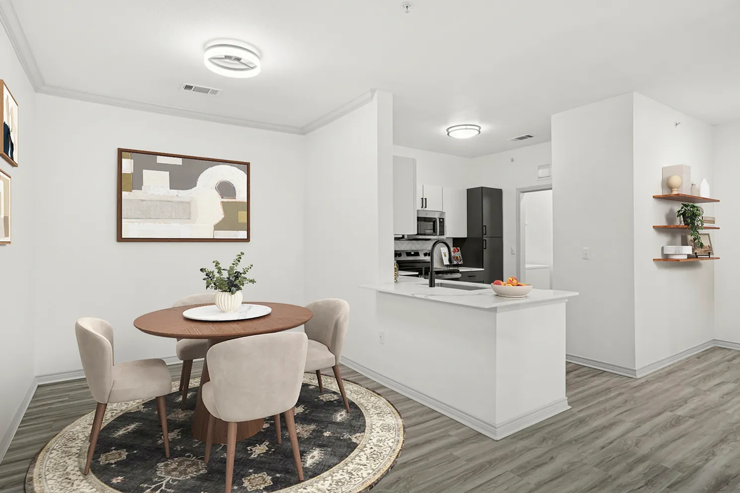 Contemporary dining area and kitchen with sleek design, featuring elegant seating, vibrant artwork, and a stylish breakfast bar.