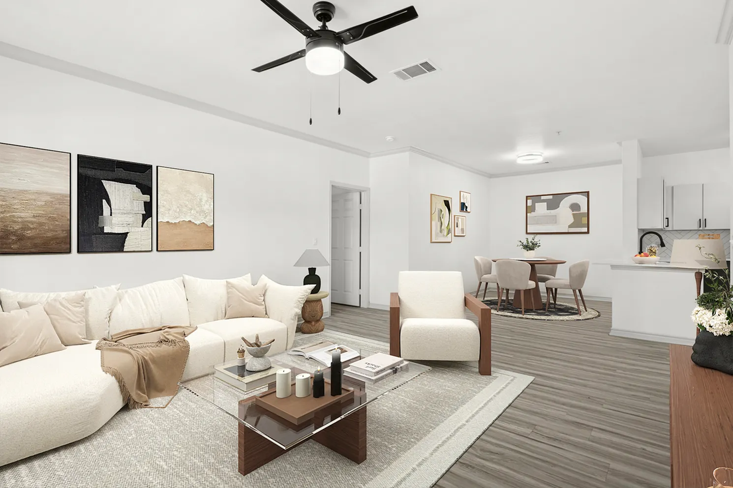 Modern open-concept living space featuring elegant furnishings, a plush sectional sofa, and a sleek dining area adjacent to a stylish kitchen.
