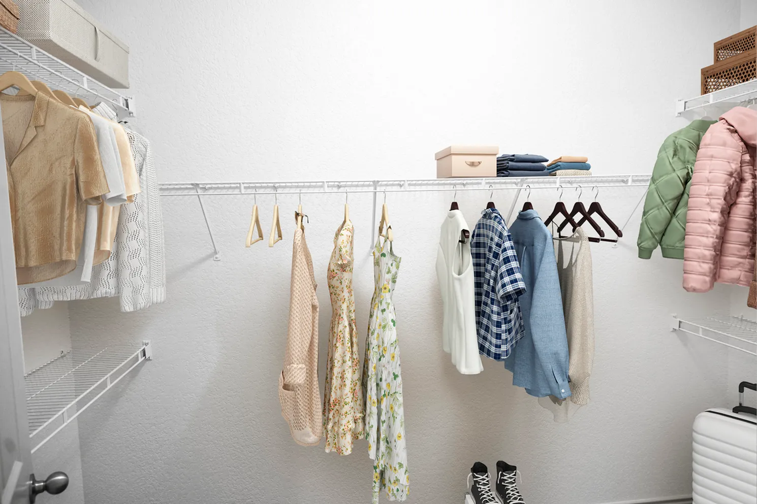Spacious walk-in closet with neatly organized clothing, hangers, and storage boxes, ideal for maintaining a stylish and clutter-free home.