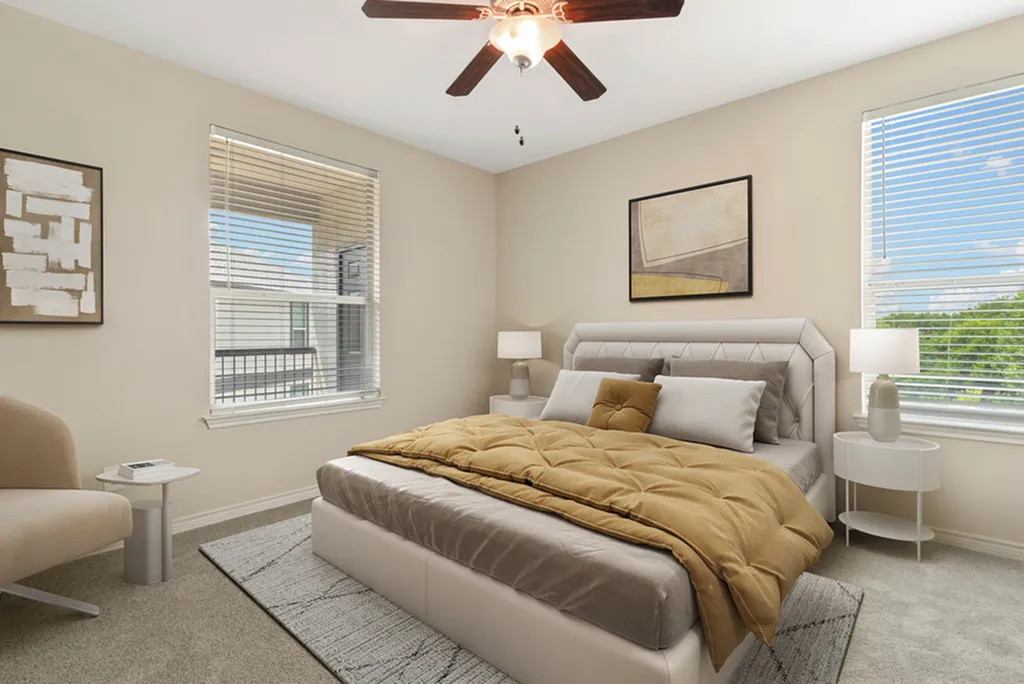 Bright and cozy bedroom featuring elegant decor, a plush bed, soft lighting, and large windows with a scenic view.