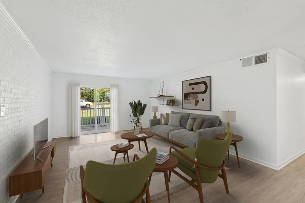Bright and airy living room with stylish furniture, modern decor, and access to a private patio.