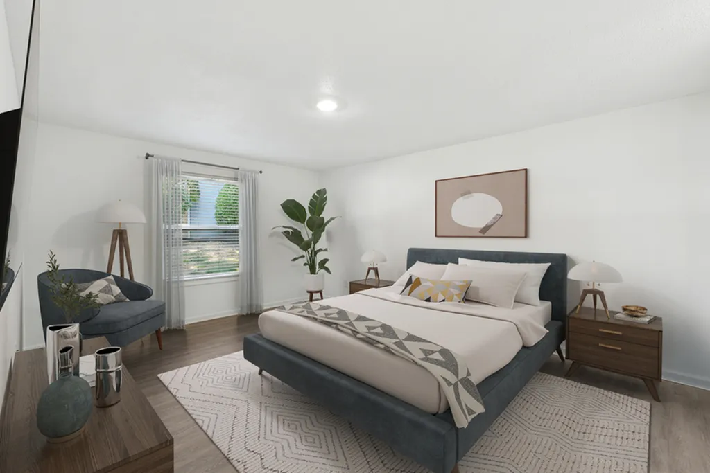 Inviting bedroom with modern decor, featuring a plush bed, chic nightstands, and abundant natural light through a large window.